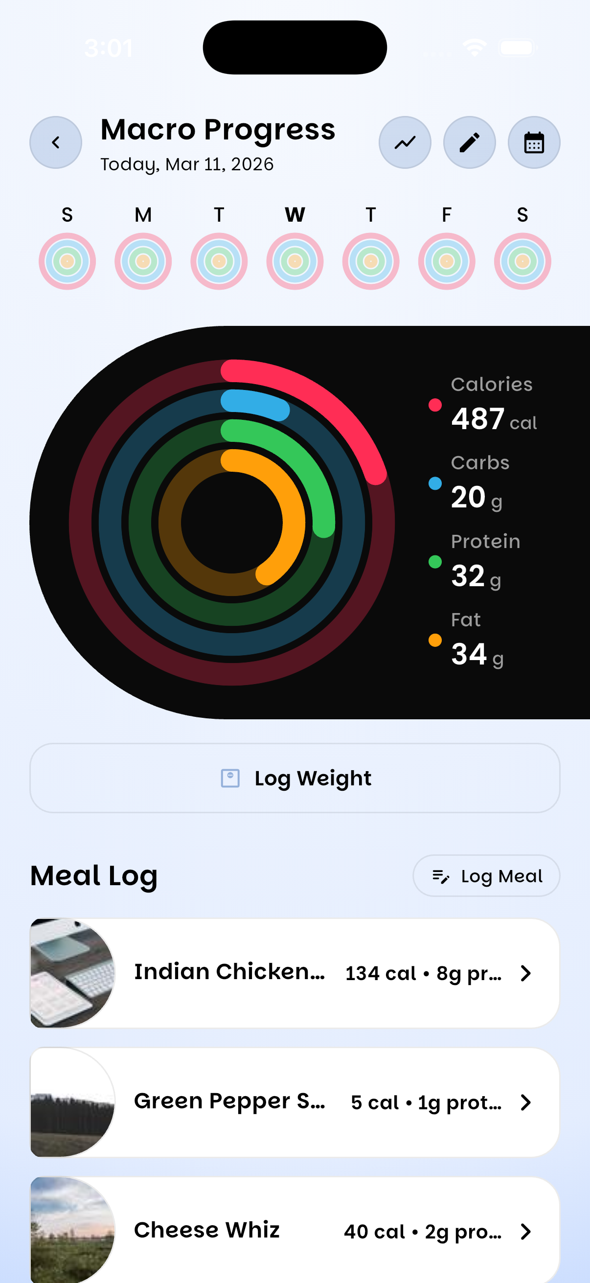 UPlate macro progress rings tracking calories, carbs, protein and fat against daily goals, above the day's meal log